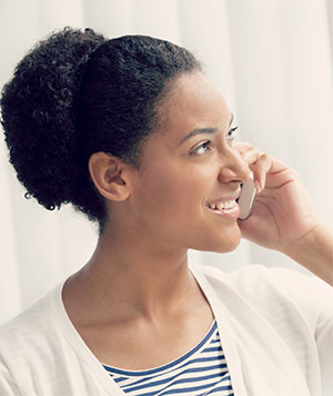 woman holding phone smiling