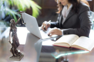 A lawyer sits at her desk and works on a hernia mesh lawsuit