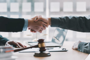 A lawyer and client shake hands