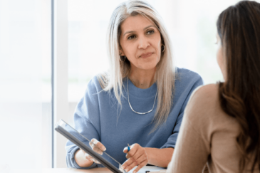 A lawyer talks to a client about a lawsuit