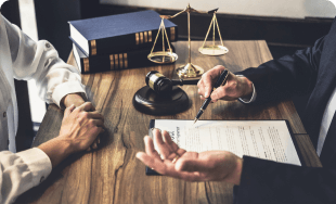 A mesothelioma lawyer consults with a client