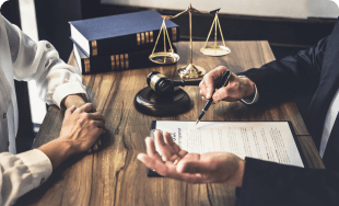 A client meets with a lawyer