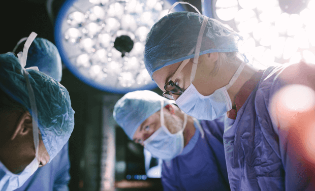 A team of doctors performs a surgery