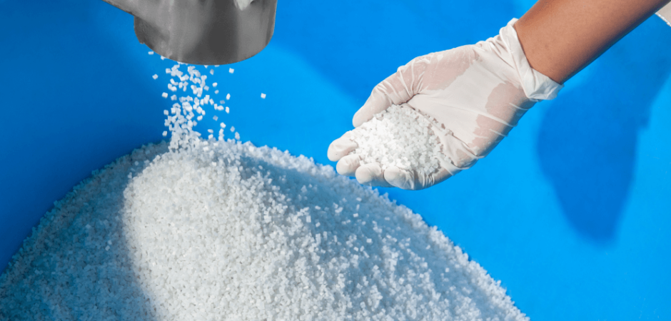 A worker handles PFAS plastics