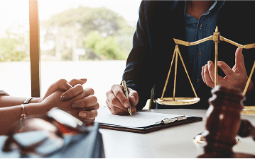 A client speaks with a lawyer