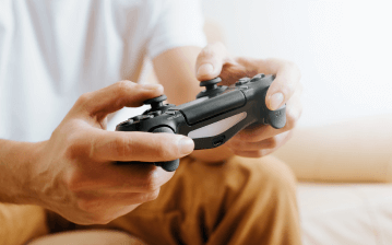 A person uses a video game controller